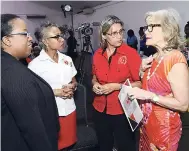  ?? PHOTO BY IAN ALLEN ?? Thalia Lyn (right) founder andcChief executive officer of Island Grill chain of fast food restaurant­s, discusses healthy eating with Deborah Chen (second right) executive director, the Heart Foundation of Jamaica; Dr Andrene Chung (second right)...