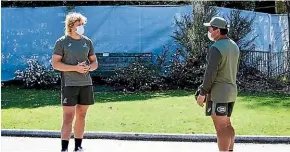  ?? WALLABIES MEDIA ?? Ned Hannigan (left) social distances from coach Dave Rennie at their Christchur­ch quarantine base near Hagley Park.