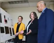  ?? SUBMITTED PHOTO ?? Chester County Commission­ers Michelle Kichline, left, Kathi Cozzone and Terence Farrell look over the redacted pipeline safety plan.