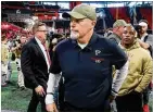  ?? CURTIS COMPTON / CCOMPTON@AJC.COM ?? Coach Dan Quinn walks off the field Sunday after his Falcons lost their fourth straight at home.