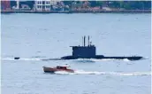  ??  ?? An Ay-class submarine of the Turkish Navy sets sail in the Bosporus, on its way to the Marmara Sea, in Istanbul, in a file photo. Turkey’s acquisitio­n of German submarines would upset the balance of power in the Aegean.