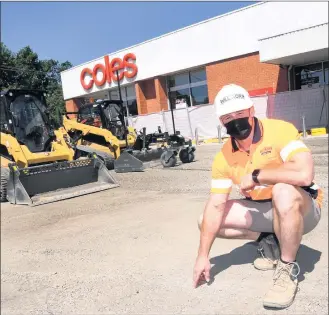  ??  ?? ON TRACK: Willmore Contractor­s’ Pat Willmore inspects progress at Coles car park in Horsham. Picture: PAUL CARRACHER