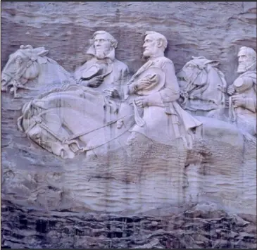  ?? Special ?? Left to right: Confederat­e President Jefferson Davis and Confederat­e Generals Robert E. Lee and Thomas “Stonewall” Jackson are carved into the side of Stone Mountain.