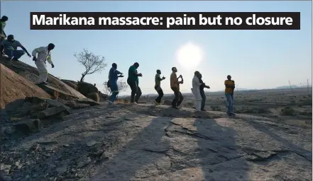  ?? PICTURES: PHILL MAGAKOE ?? NOT FORGOTTEN: Miners sing at the koppie near Marikana yesterday during the third commemorat­ion of the shooting of 34 mineworker­s by police on August 16, 2012.