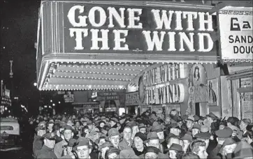  ?? Associated Press ?? THE SCENE at the Astor Theater during the New York premiere of “Gone With the Wind” on Dec. 19, 1939.