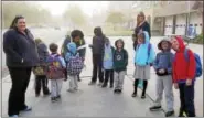  ?? PHOTO COURTESY OF POTTSTOWN SCHOOL DISTRICT ?? Students on one of Rupert Elementary School’s Walking School Bus routes pause for a rest in front of Goodwill fire Company on High Street Wednesday during Internatio­nal Walk to School Day.