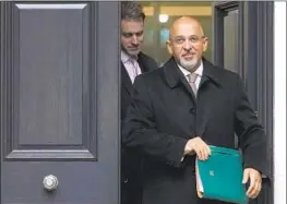  ?? Alastair Grant Associated Press ?? THEN-CHAIRMAN Nadhim Zahawi leaves the Conservati­ve Party head office Tuesday. A standards inquiry found he breached the ministeria­l code of conduct.