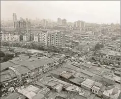  ?? HINDUSTAN TIMES ARCHIVES ?? A view of the Dharavi skyline in Mumbai. Can a formal retail store such as a Dmart actually rent a space inside one of the exslums in our metropolis­es?