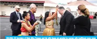  ??  ?? KOLONIA: US Secretary of State Mike Pompeo and his wife Susan are greeted by women with traditiona­l mwar mwar floral wreaths as they arrive at Pohnpei Internatio­nal Airport in Kolonia, Micronesia yesterday.