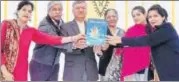  ??  ?? Principal Mohini Bindra and Atam Prakash releasing the Annual School Magazine,’samacharik­a’, of Ramjas School.