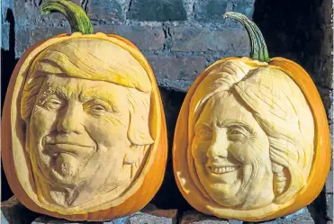  ??  ?? A couple of pumpkins... carved in the images of the presidenti­al hopefuls. Left, model Heidi Klum gets into the Halloween spirit with her turn as Jessica Rabbit.