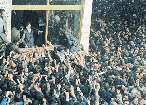  ?? MICHEL LIPCHITZ THE ASSOCIATED PRESS FILE PHOTO ?? During the Iranian Revolution of 1979, above, thousands of people were jamming daily into a Tehran schoolyard to see Ayatollah Ruhollah Khomeini.