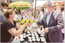  ??  ?? President Ersin Tatar was among the shoppers at the festival