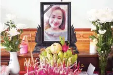  ??  ?? A portrait of Bui Thi Nhung, who is feared to be among the 39 people found dead in a truck in Britain, is kept on a prayer altar at her house in Vietnam’s Nghe An province on Sunday. — AFP