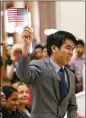  ??  ?? Jia Chen Kuo waves a flag at the 2015 event. Organizers said today’s canceled event was aimed to show support for refugees and immigrants while legislator­s are in session.