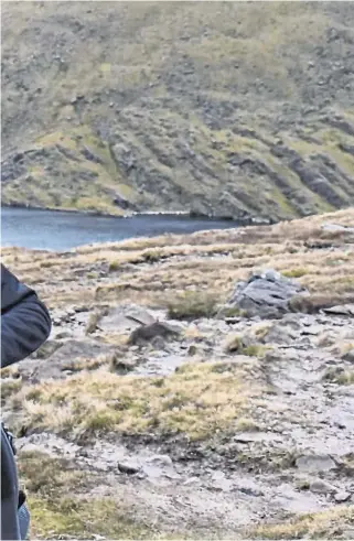  ??  ?? Natural high: Steve Golding climbing Carrauntoo­hil with the Recovery Ramblers last January