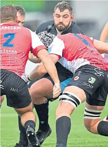  ?? ?? ON FORM: Glasgow’s Jamie Bhatti, centre, gets tackled by Pieter Jansen van Vuren.