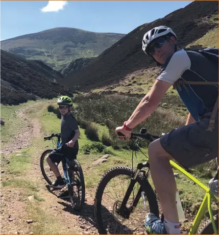  ??  ?? Cycling has enjoyed a surge during lockdown with Scott Gammie, pictured far left with sons Matt and Euan, among those getting out and about on two wheels