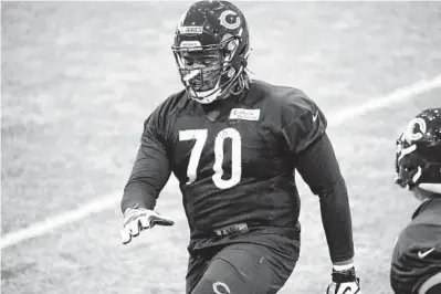  ?? JOSE M. OSORIO/CHICAGO TRIBUNE ?? Bears offensive tackle Braxton Jones stretches at rookie minicamp Friday at Halas Hall in Lake Forest.