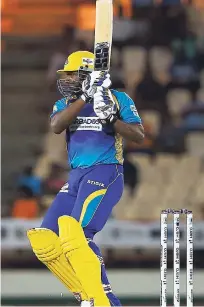  ?? CPL T20 VIA GETTY IMAGES ?? Kieron Pollard of the Barbados Tridents hits a boundary during Match 8 of the 2017 Hero Caribbean Premier League between St Lucia Stars and the Barbados Tridents at the Darren Sammy Stadium on Thursday.