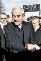  ?? JIM YOUNG/REUTERS PHOTO ?? Texas Rep. Ron Paul, greeting supporters in West Des Moines, was making a strong thirdplace showing in returns Tuesday night.