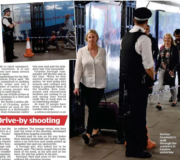  ??  ?? Arches: Commuters walk through the scanners in London yesterday