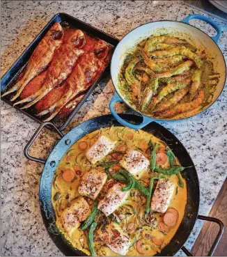 ?? HUNT STYLING BY ASHA GOMEZ / CONTRIBUTE­D BY CHRIS ?? Whole Roast Fish (clockwise from top left), Quick Sauteed Shrimp and Fish Curry are three dishes that help Atlanta chef Asha Gomez stay connected to Kerala, India.