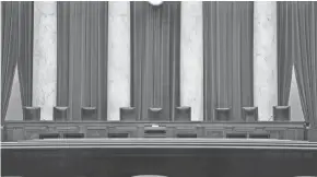  ?? J. SCOTT APPLEWHITE/AP FILE ?? Some Democratic lawmakers have proposed adding four chairs to the nine justices’ seats on the Supreme Court bench.