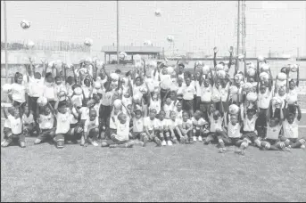  ??  ?? Members of the participat­ing schools posing for the cameras at the start of the GFF Concacaf Next Play Festival at the National Training Center, Providence