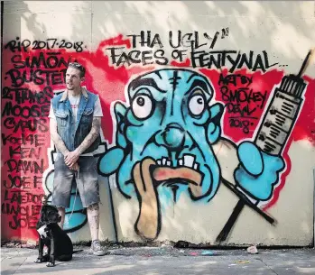  ?? DARRYL DYCK/THE CANADIAN PRESS ?? Peer support worker Trey Helten, with his dog Princess Zelda in the Downtown Eastside, spends at least five hours a day volunteeri­ng with the Overdose Prevention Society.