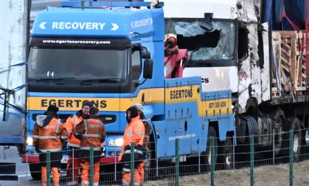  ?? — AFP photo ?? Workers recover lorries blown over on the M6 motorway during the high winds of Storm Isha, near Shap, north west England.