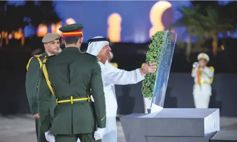  ?? WAM ?? His Highness Shaikh Saud Bin Saqr Al Qasimi, UAE Supreme Council Member and Ruler of Ras Al Khaimah places a wreath at the Wahat Al Karama memorial during Commemorat­ion Day ceremonies.
