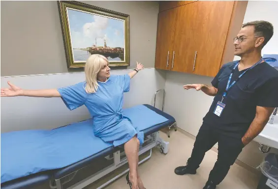  ?? PETER J. THOMPSON ?? Breast cancer patient Sharon Dunn sees surgical oncologist Dr. Brian Pinchuk at North York General Hospital in Toronto in early September.