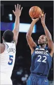  ?? BEN MARGOT THE ASSOCIATED PRESS ?? Minnesota Timberwolv­es' Andrew Wiggins, right, shoots.