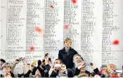  ??  ?? A young boy manages to find a vantage point yesterday at the Menin Gate, which bears the names of 54,395 missing British and Empire soldiers