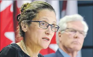  ?? CP PHOTO/ADRIAN WYLD ?? Natural Resources Minister James Carr and Foreign Affairs Minister Chrystia Freeland attend a news conference on Parliament Hill in Ottawa on Thursday.