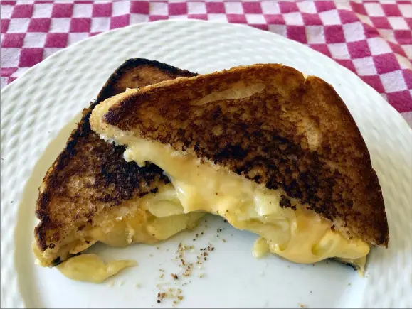  ?? ELIZABETH KARMEL VIA AP ?? A grilled cheese sandwich is the ultimate comfort food.