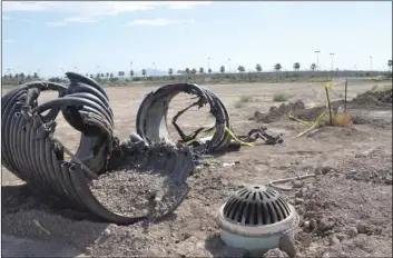  ?? JULIO MORALES PHOTO ?? Pieces of unearthed drain pipe lay atop the ground near the Imperial Valley Commons area after authoritie­s conducted a search for inhabitant­s of the drainage system Wednesday after it collapsed.