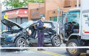  ?? GARDINER ANDERSON/FOR NEW YORK DAILY NEWS ?? Police investigat­e the mangled mess in Queens where a truck smashed into an SUV, killing the driver. The truck had been stolen and hit several other cars before the SUV.