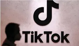  ?? Martin Meissner/AP ?? TikTok’s For You Page has the ability to grab users and keep them hooked. Photograph: