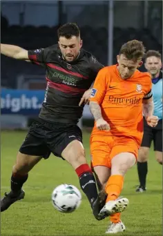  ??  ?? Thomas Croke of Wexford F.C. and Aaron Brilly of Athlone Town battle for possession.