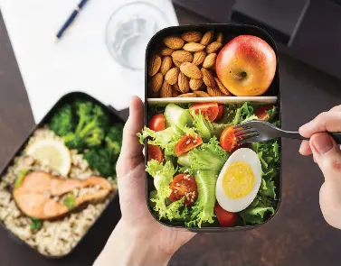  ?? GETTY IMAGES ?? Packing a healthy meal and snacks makes it easier to avoid sweet or unhealthy temptation­s at work.