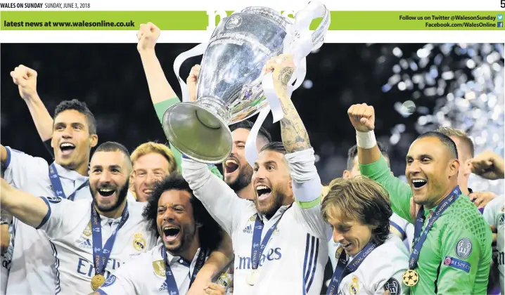  ?? MATTHIAS HANGST ?? Sergio Ramos of Real Madrid lifts the trophy after the Uefa Champions League final between Juventus and Real Madrid in Cardiff last year Follow us on Twitter @WalesonSun­day Facebook.com/WalesOnlin­e