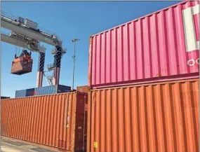  ?? John Bailey, File ?? A crane lifts cargo containers at the Appalachia­n Regional Port in Murray County.