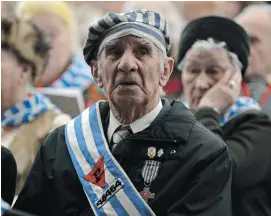  ?? JANEK SKARZYNSKI/AFP/GETTY IMAGES ?? Former concentrat­ion camp prisoners attended a ceremony at the memorial site of the former Nazi concentrat­ion camp Auschwitz-Birkenau in Oswiecim, Poland, on Sunday.