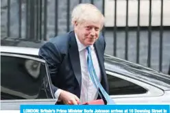  ?? —AFP ?? LONDON: Britain’s Prime Minister Boris Johnson arrives at 10 Downing Street in central London yesterday after travelling back from New York.