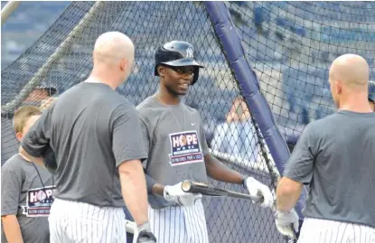  ?? | AP ?? The Cubs drafted Chris Singleton ( center), the son of a Charleston, South Carolina, shooting victim, in the 19th round.