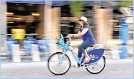  ?? JEFFREY LANGLOIS / PALM BEACH DAILY NEWS ?? Barbara Marshall zips down Clematis Street on a rented SkyBike.