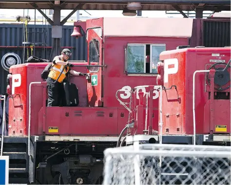  ?? JEFF MCINTOSH/THE CANADIAN PRESS ?? The unions for CP Rail workers said they are ready to exercise their right to strike if talks fail or the company does not wish to bargain. The company said it offered “significan­t improvemen­ts to wages, benefits and working conditions,” but most...