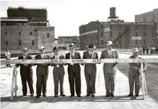  ?? Houston Chronicle ?? Barricades to the new Milam Street Bridge are removed by Mayor Oscar Holcombe and City Council members on April 21, 1947.